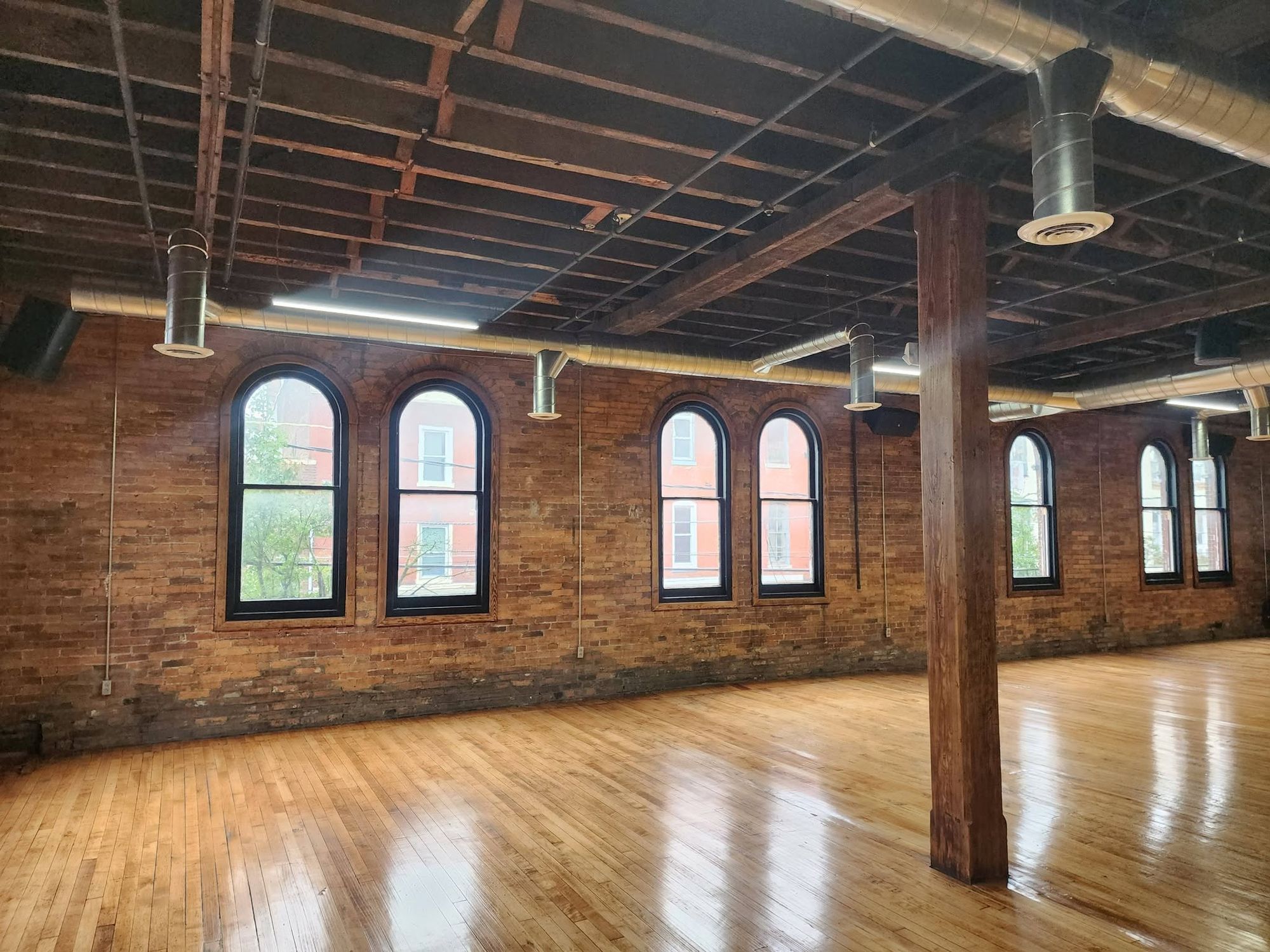 Arched windows in the exposed brick wall